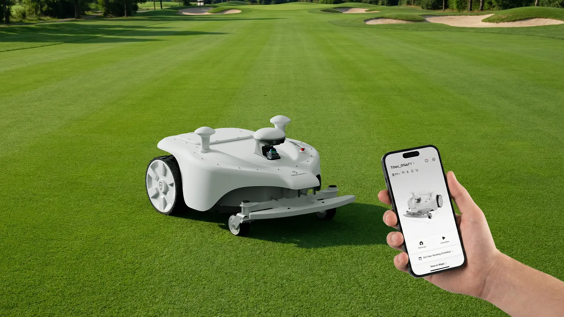FJD Titan on turf beside a phone showing the GreenMaster fleet management app