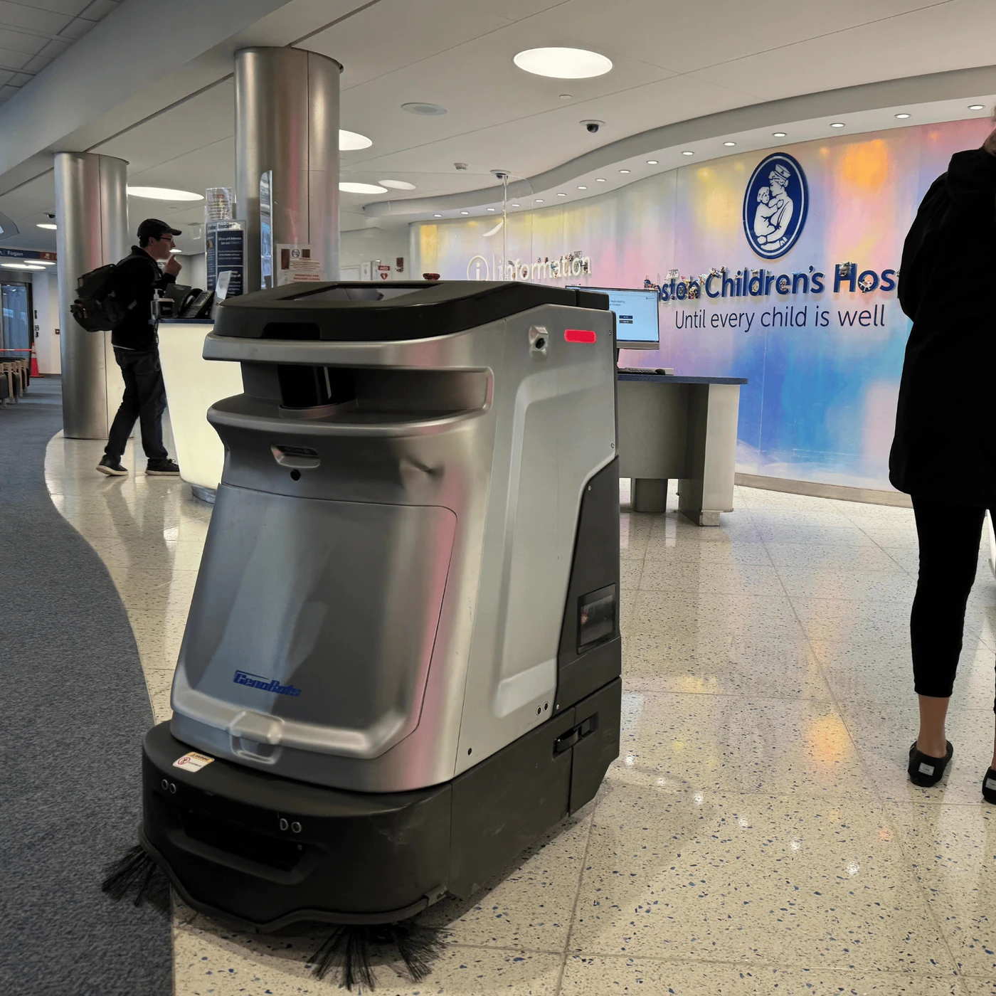 Autonomous spot cleaner working a hospital information lobby