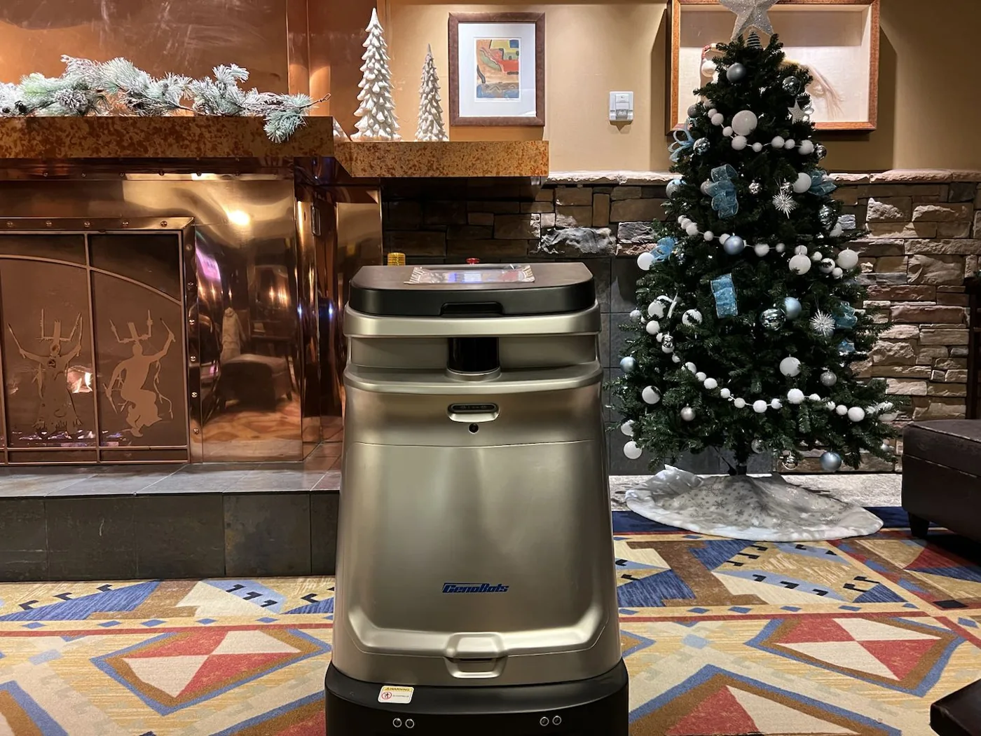 An autonomous SP50 spot cleaner in a hotel lobby